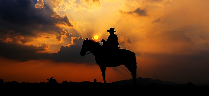 Cowboy silhouette at sunset
