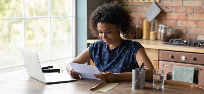 Woman Looks at Financial Statement