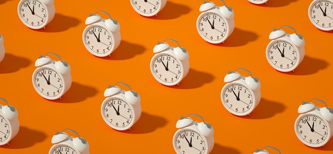 Article_White-Clocks-on-an-Orange-Background_680x315