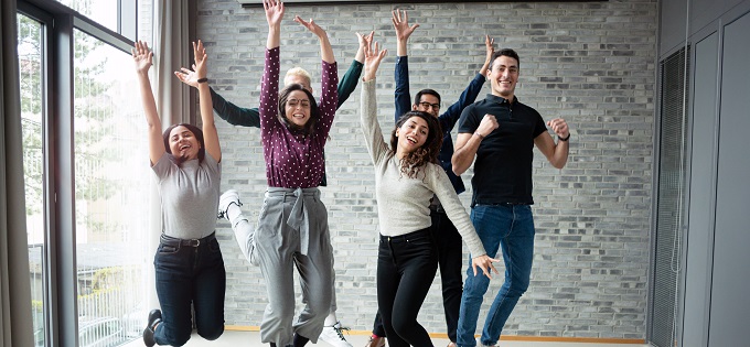 Office Workers Jumping for Joy