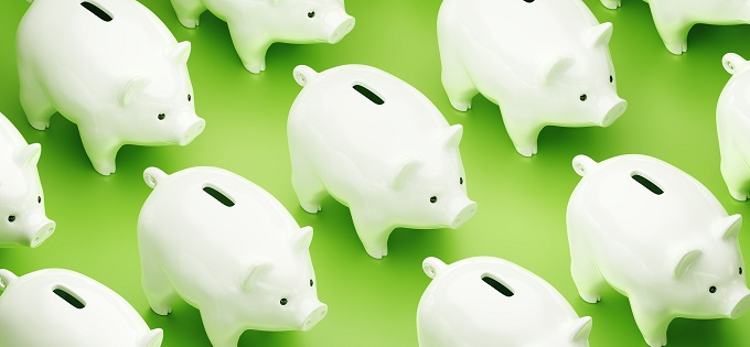 White Piggy Banks on Green Background