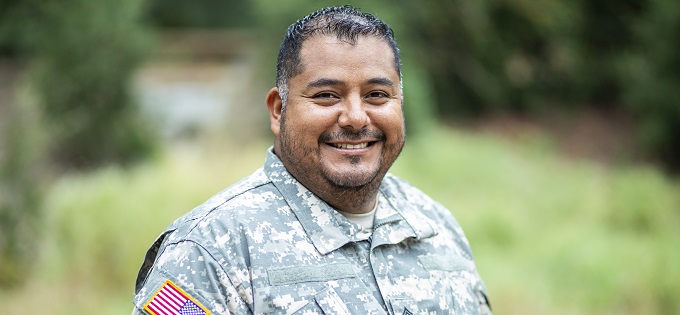 Soldier Smiles in Green Field