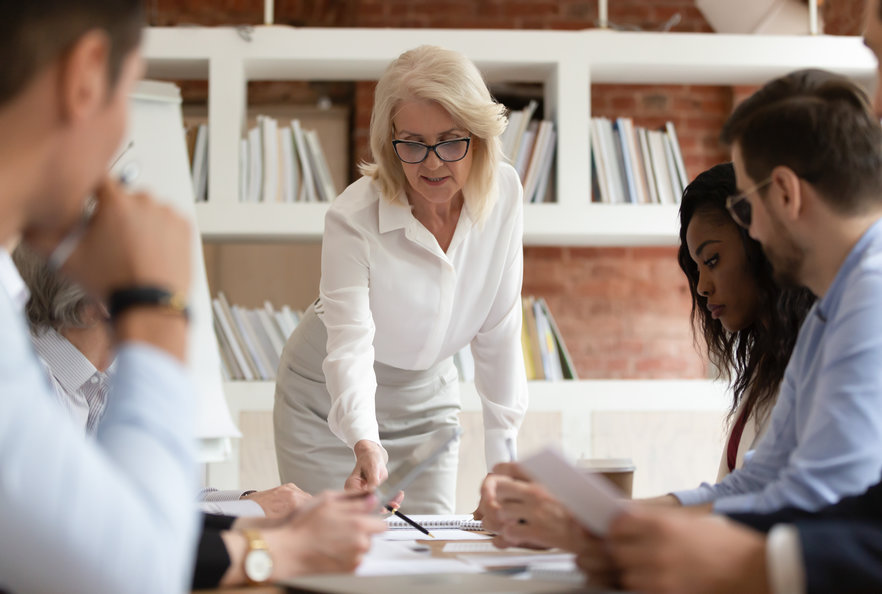 Woman explaining plan to team