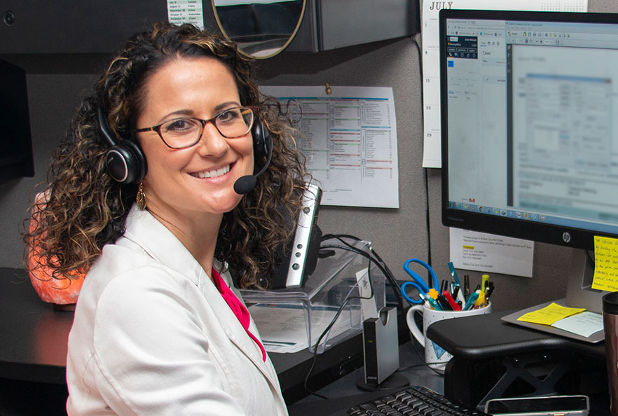 Woman smiling at her work desk