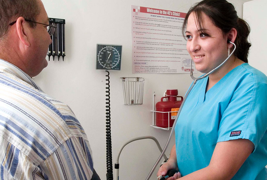 Nurse Guadalupe Rendiz measuring blood pressure